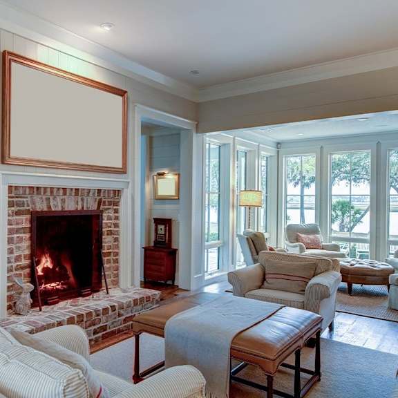 a living room with a fireplace and a couch.