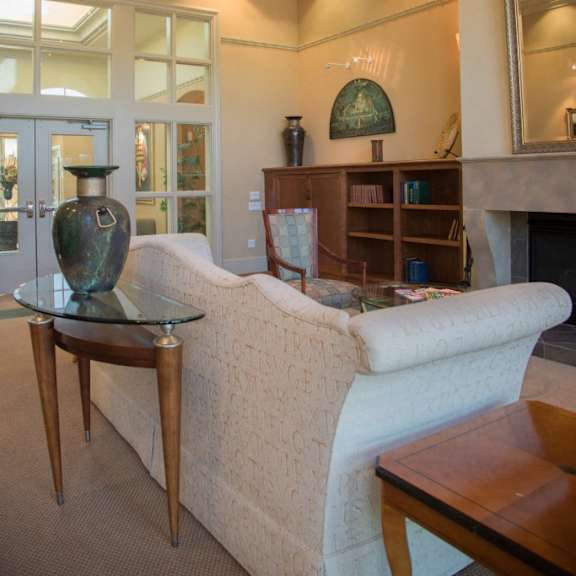 a living room with a white couch and a table