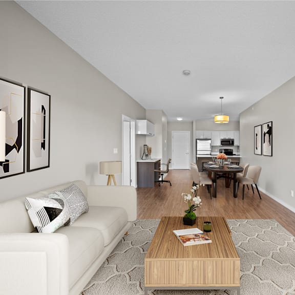 a living room and dining room with a couch and a table