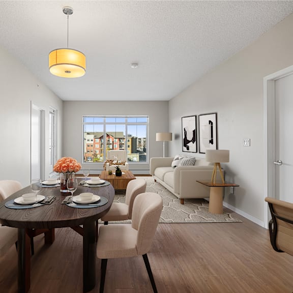 a living room and dining room with a table and chairs