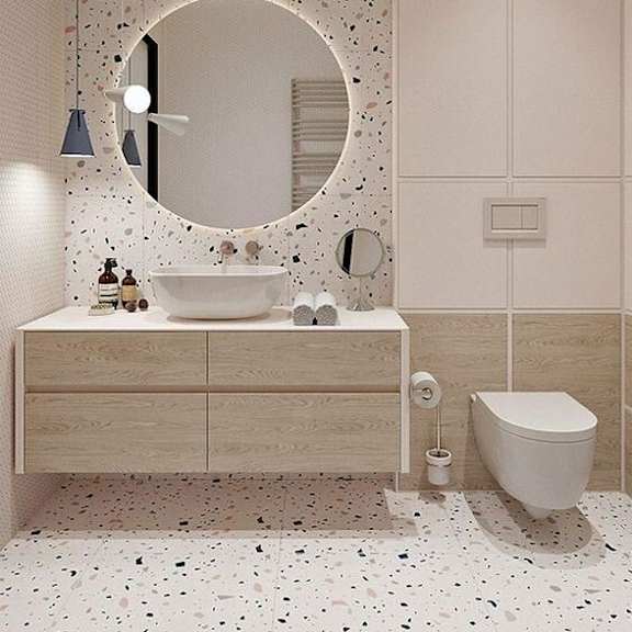 Thumbnail 3 of 3 a bathroom with a mirror and a toilet and a sink