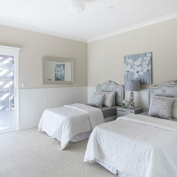 Thumbnail 3 of 4 two beds in a bedroom with a sliding glass door