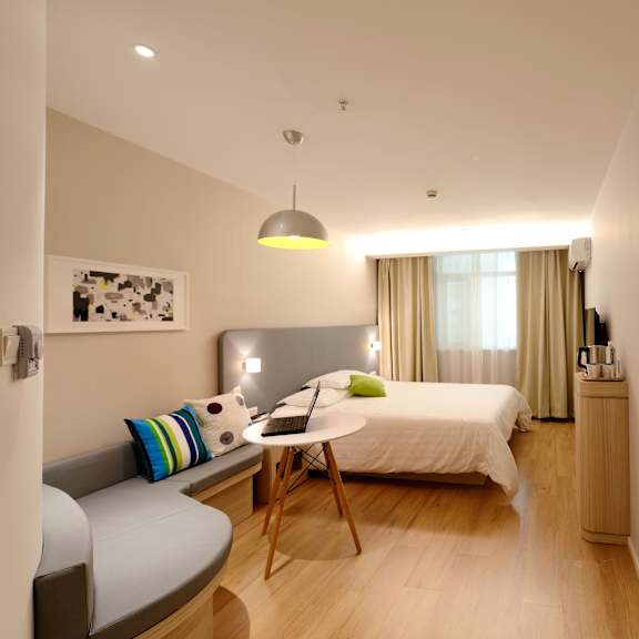 master bedroom with queen beds and a desk