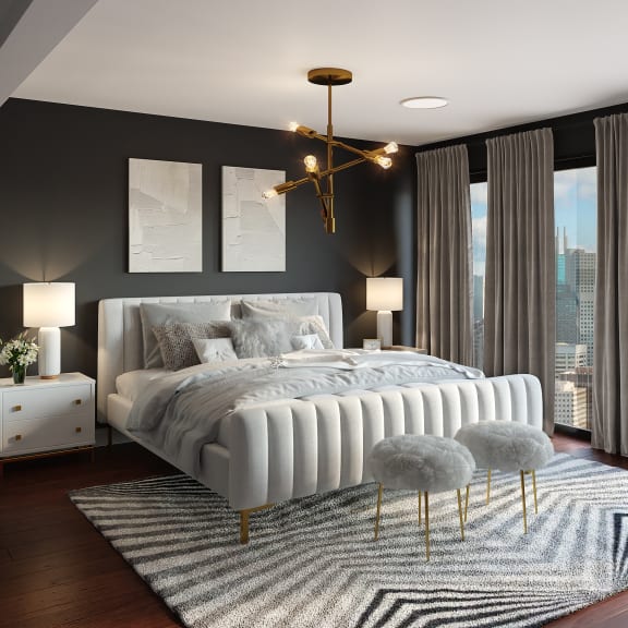 a bedroom with a bed and a rug and a chandelier