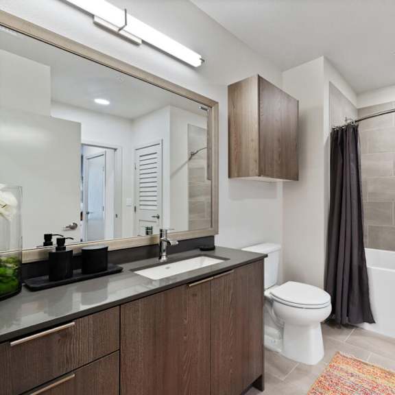 a bathroom with a sink toilet and bathtub