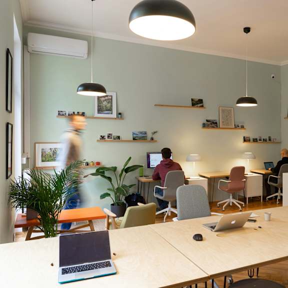 a group of people working in a modern office space.