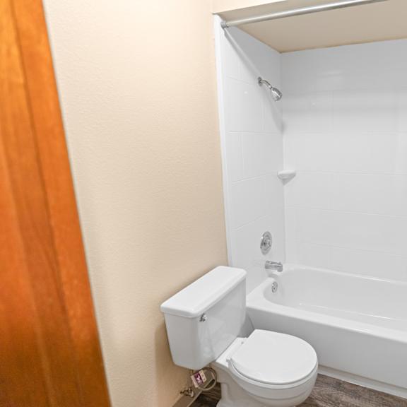 a white toilet and sink in a small bathroom.