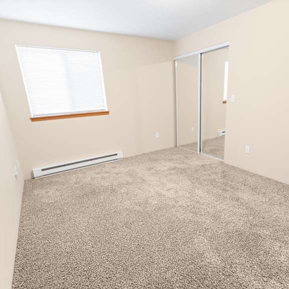 a room with a carpeted floor, a window with blinds, a door, and a wall-mounted light switch.