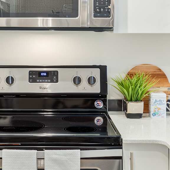 a stainless steel oven with a digital control panel is in a kitchen.