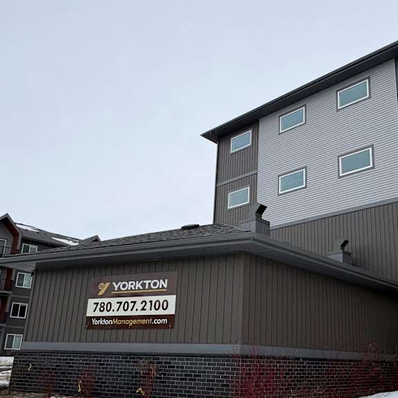a building with a sign that says yorkton and a phone number on it.