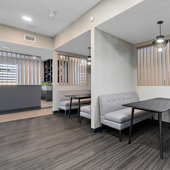 a living room with two couches and a table