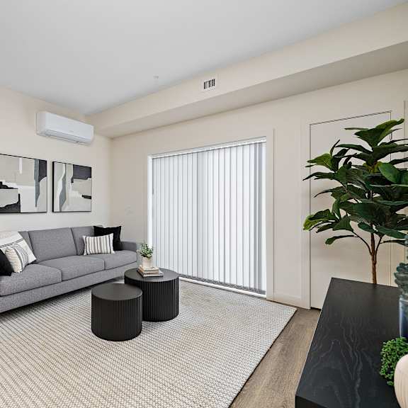 modern living room with gray sofa at mac and mullen apartments, edmonton, alberta