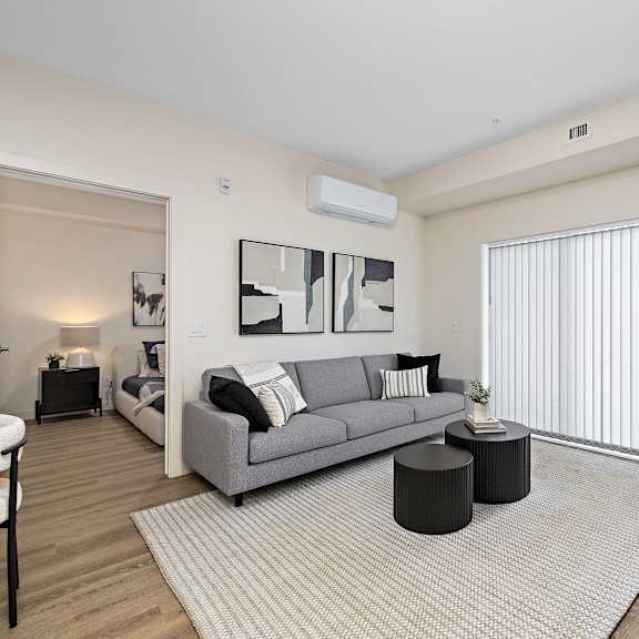 a living room with a couch and a coffee table    and a large