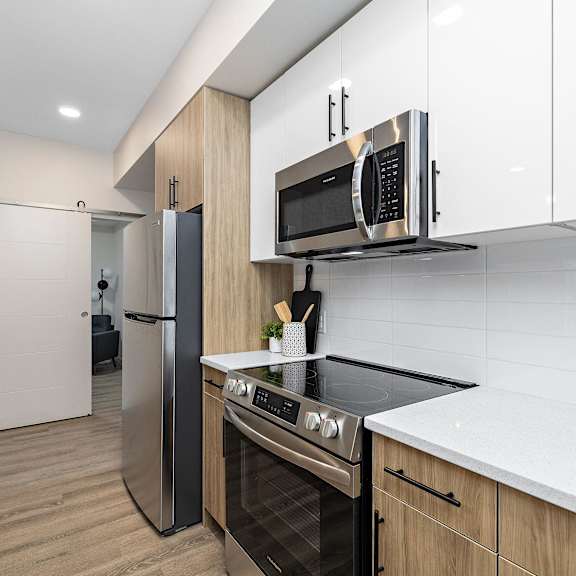 a kitchen with a stove and a microwave