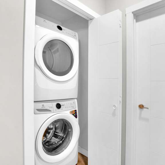 in unit washer and dryer in closet at plaza apartments, alberta, t2l 2m8
