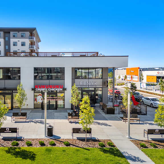 retail shops and restaurants with modern architecture at plaza apartments, calgary