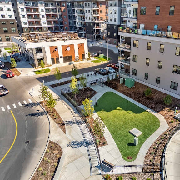 aerial view of courtyard with green space at plaza apartments, alberta