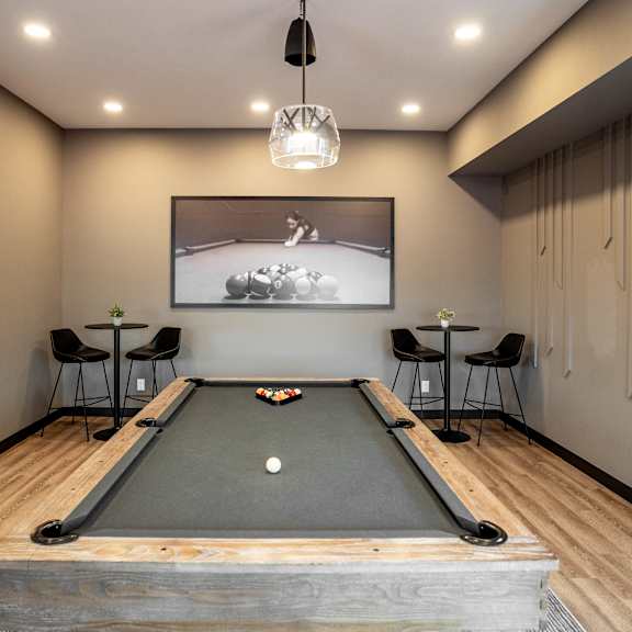 a pool table at podium apartments, calgary