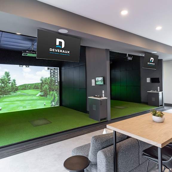 a room with a devarox sign on the wall and a golf simulator.