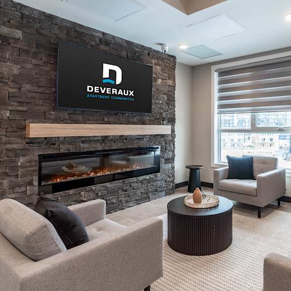 modern lounge with stone fireplace and seating at mac and mullen apartments, edmonton