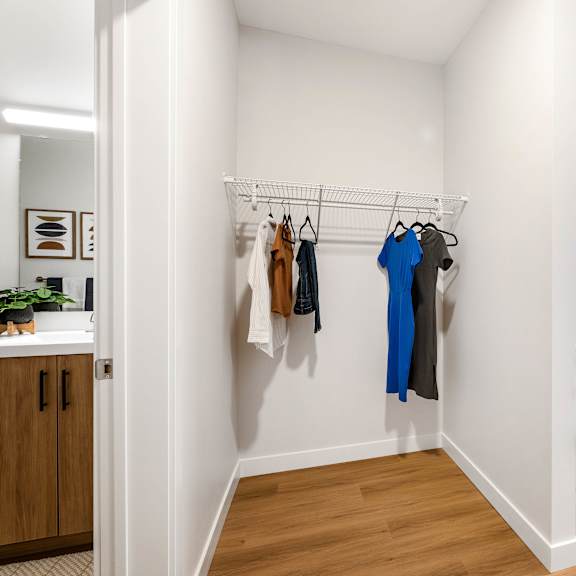 a bedroom with a bed, a wardrobe, and a window.