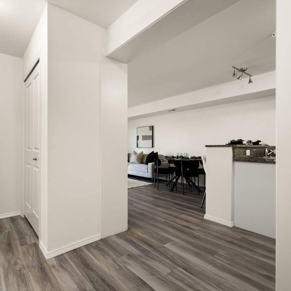 a room with a dining table and chairs.