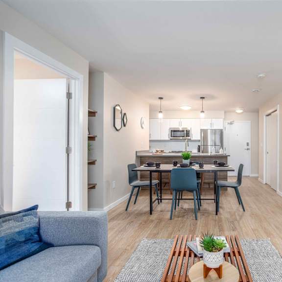 living room with dining area at g17 apartments at tamarack, edmonton
