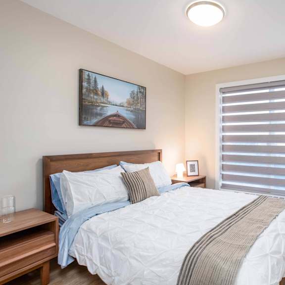 comfortable bedroom at g17 apartments at tamarack, edmonton