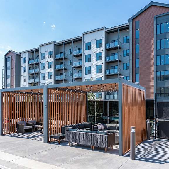 a modern building with a wooden fence in front.