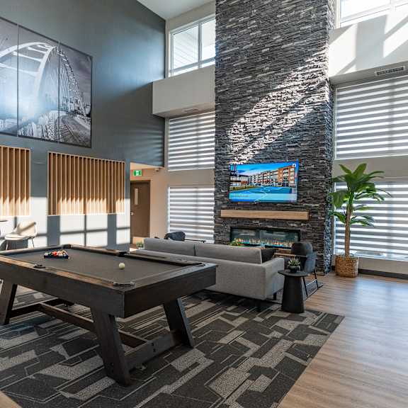 a room with pool table at cadence at griesbach, edmonton, alberta