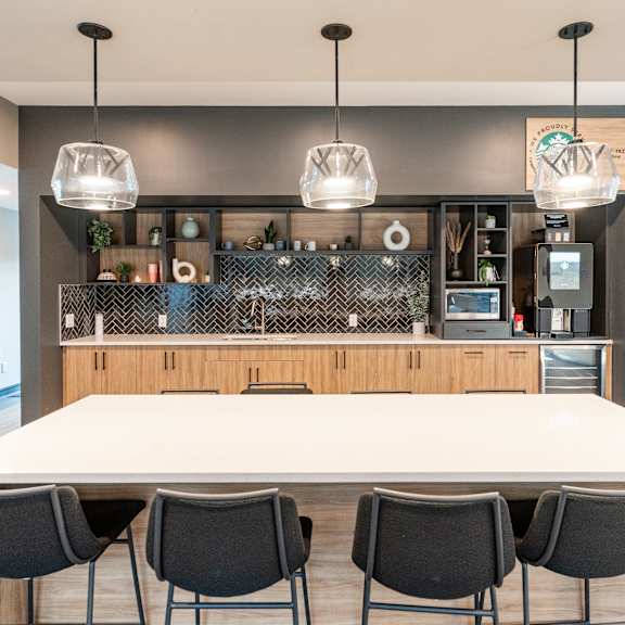 a long table and chairs at cadence at griesbach, edmonton, t5e 1y8
