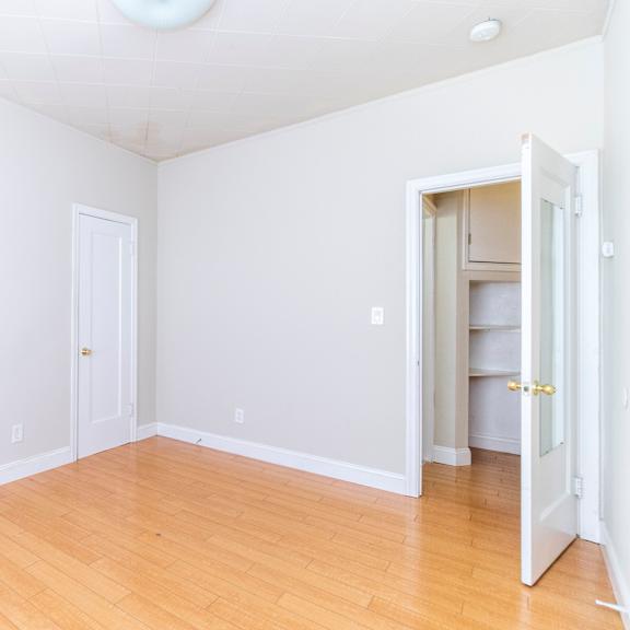 a room with a white door and a white wall.