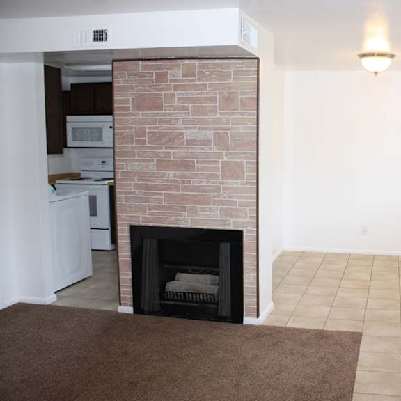 a room with a fireplace and a door.