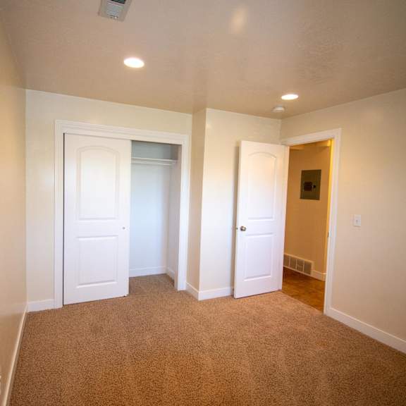 a room with carpeted floor and white walls.