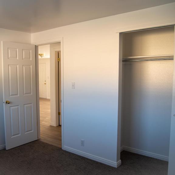 a room with a white door and a white wall.