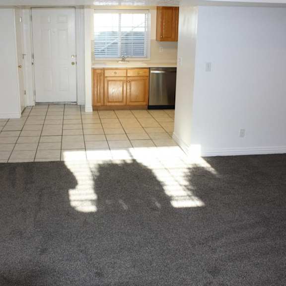 a kitchen area with a sink and a window.