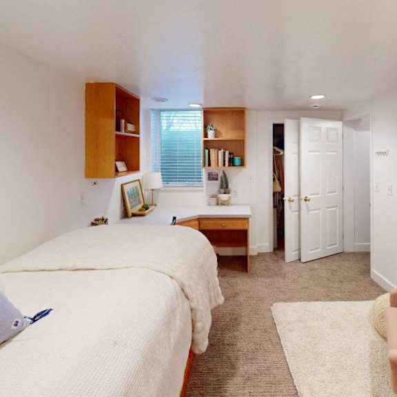 a bedroom with two beds and a dresser.