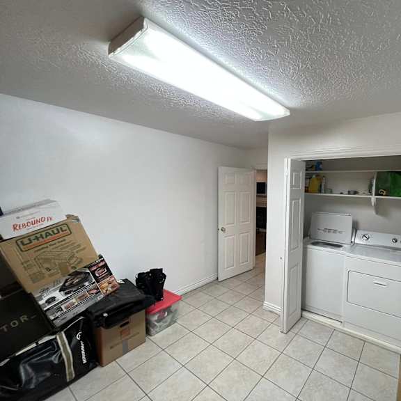 a room with a washer and dryer in it.