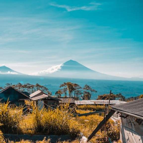 a small village with mountains in the background