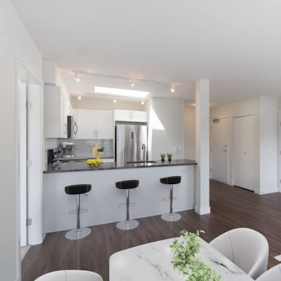 a kitchen and living room in a 555 waverly unit