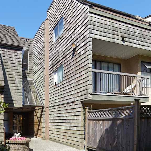a house with a gray shingle roof