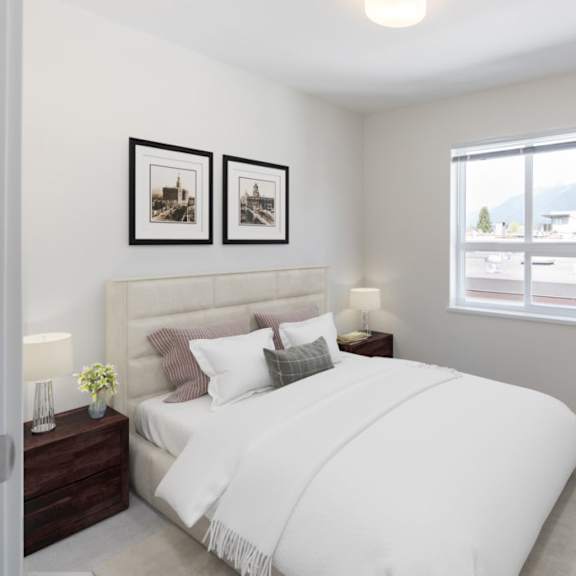 a bedroom with a large bed and two night stands with lamps