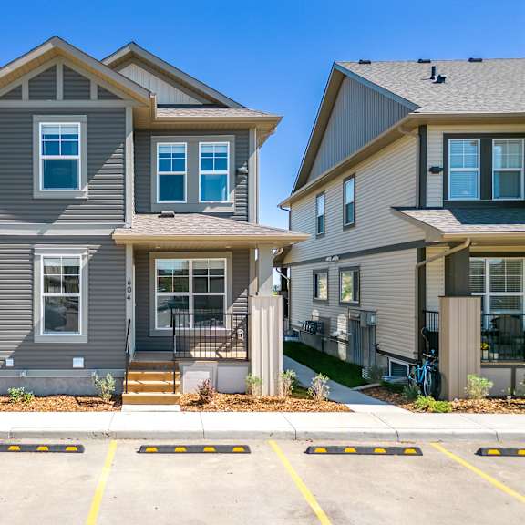 a row of houses on the side of a street