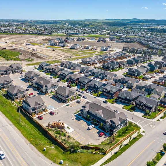 an aerial view of a neighborhood of houses on a street and an intersection