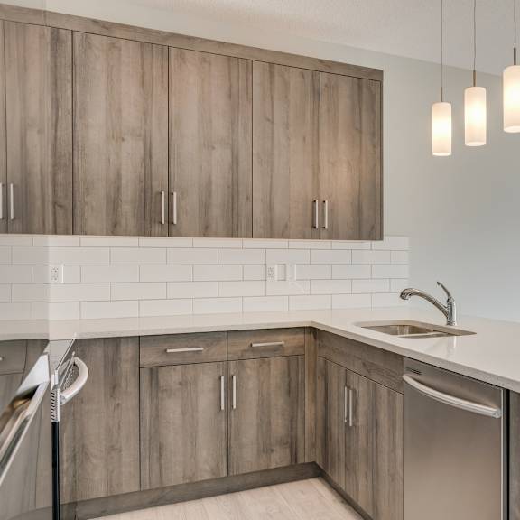 a kitchen with wooden cabinets and a sink