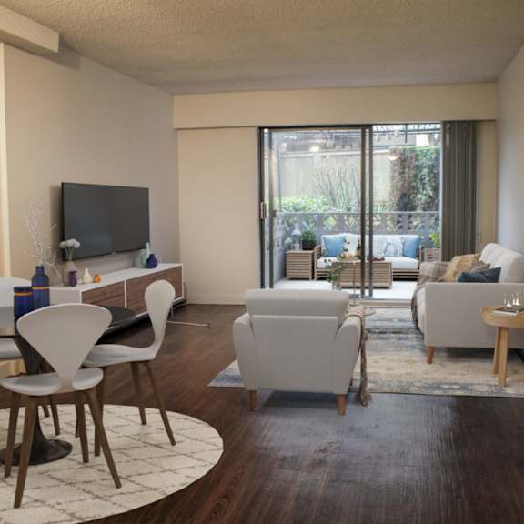 a living room with white furniture and a sliding glass door leading to a patio