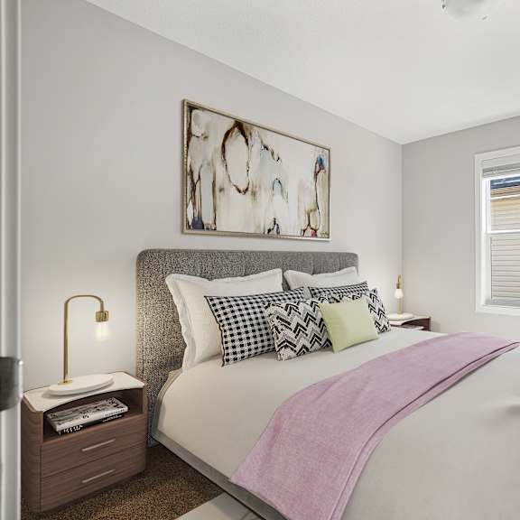a bedroom with a large bed and a window