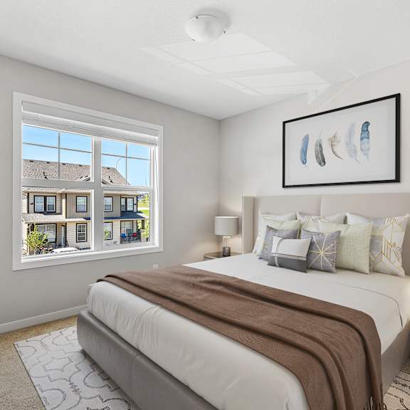 a bedroom with a large bed and a window