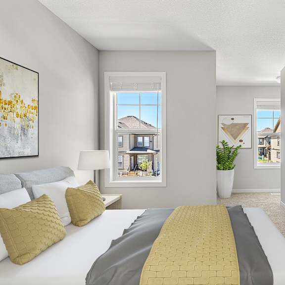 a bedroom with a large bed and a tv