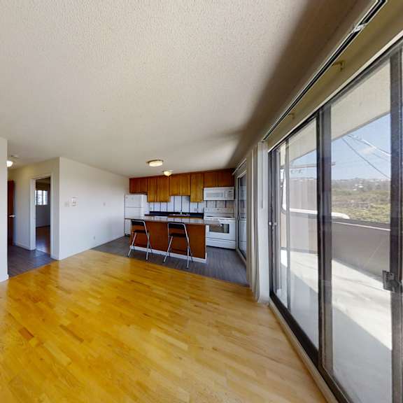 a room with wooden floors and white walls.